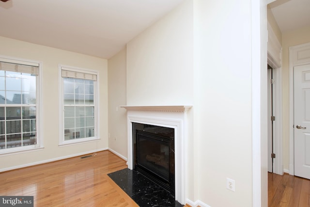 9573 5th Pl, Lorton, VA 22079 - detailed view of wood finished floors and a fireplace with flush hearth