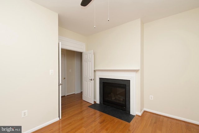 9573 5th Pl, Lorton, VA 22079 - unfurnished living room with light wood-style flooring, a fireplace with flush hearth, and ceiling fan