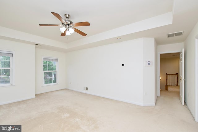 9573 5th Pl, Lorton, VA 22079 - unfurnished room featuring light carpet, ceiling fan, and a tray ceiling