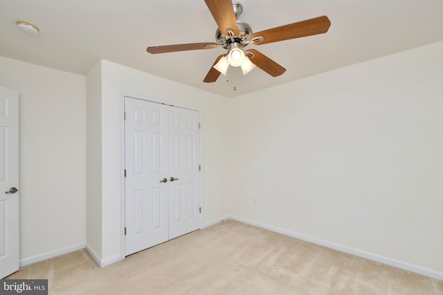 9573 5th Pl, Lorton, VA 22079 - unfurnished bedroom featuring light carpet, a closet, and ceiling fan