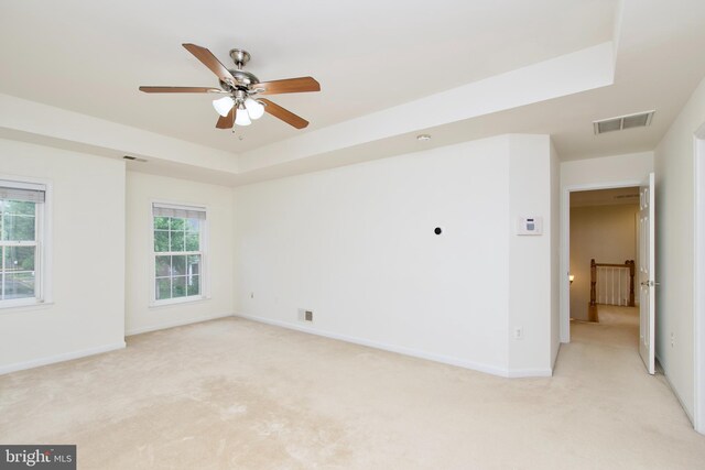 9573 5th Pl, Lorton, VA 22079 - unfurnished room featuring light carpet, ceiling fan, and a tray ceiling