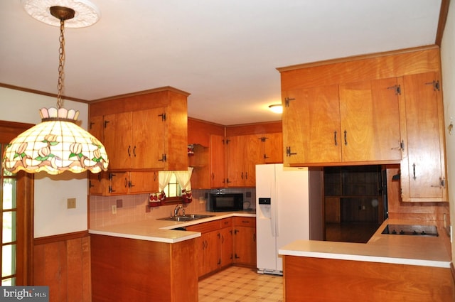 3202 Holly Ln, Cambridge, MD 21613 - kitchen with black appliances, a sink, a peninsula, and light countertops