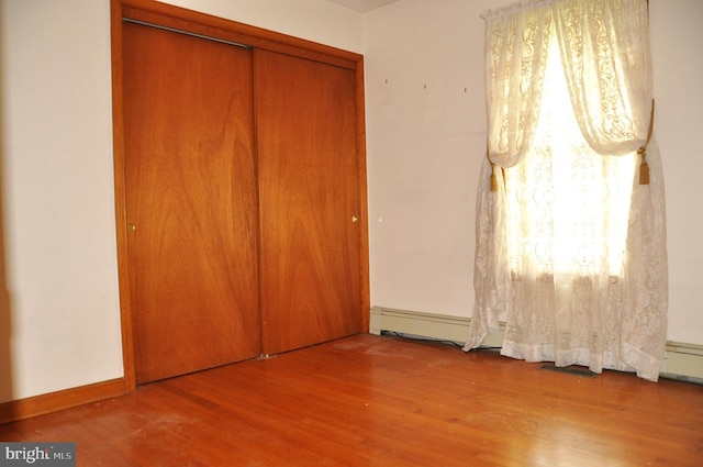 3202 Holly Ln, Cambridge, MD 21613 - unfurnished bedroom with wood finished floors and a closet