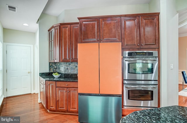 5968 Manorview Way, Alexandria, VA 22315 - kitchen with fridge, double oven, light wood-style floors, dark stone countertops, and recessed lighting