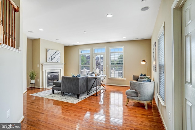 5968 Manorview Way, Alexandria, VA 22315 - living room with light wood finished floors, a premium fireplace, and recessed lighting