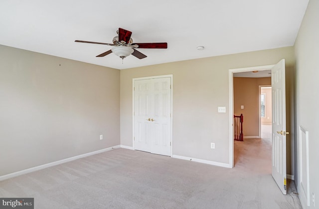 5968 Manorview Way, Alexandria, VA 22315 - unfurnished bedroom featuring light carpet, a closet, and ceiling fan