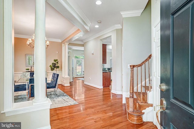 5968 Manorview Way, Alexandria, VA 22315 - entrance foyer featuring ornate columns, crown molding, light wood-style floors, stairs, and recessed lighting