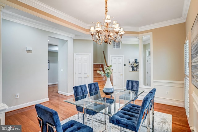 5968 Manorview Way, Alexandria, VA 22315 - dining area with decorative columns, a chandelier, wood finished floors, and crown molding