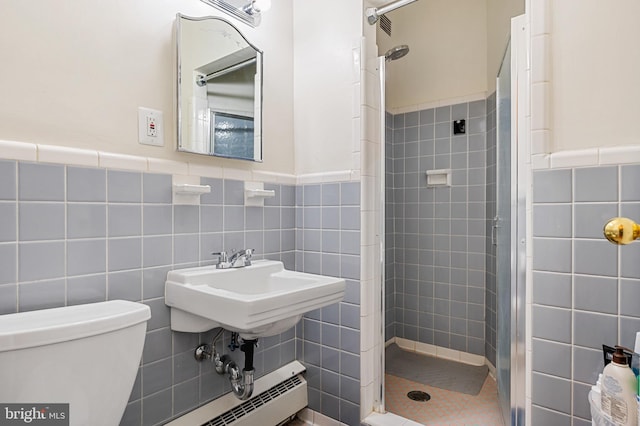 4200 Cathedral Ave NW Unit 1112, Washington, DC 20016 - bathroom featuring tile walls, a shower stall, toilet, and wainscoting