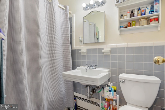 4200 Cathedral Ave NW Unit 1112, Washington, DC 20016 - bathroom featuring tile walls, toilet, a baseboard radiator, a shower with curtain, and wainscoting
