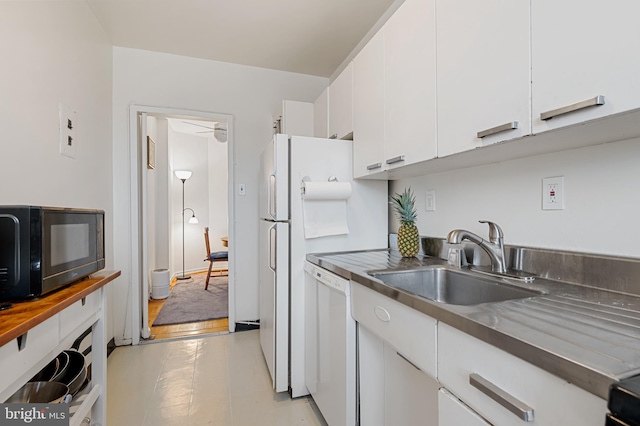 4200 Cathedral Ave NW Unit 1112, Washington, DC 20016 - kitchen with white dishwasher, a sink, black microwave, white cabinets, and stainless steel countertops