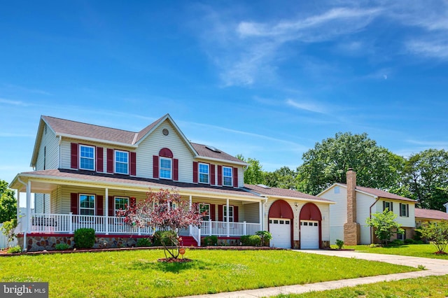 4109 Leisure Dr, Temple Hills, MD 20748 - colonial home with covered porch, an attached garage, concrete driveway, and a front lawn