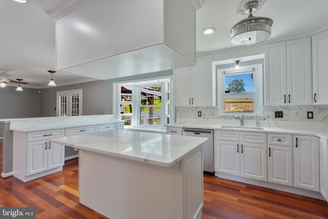 4109 Leisure Dr, Temple Hills, MD 20748 - kitchen with dishwasher, a sink, ornamental molding, a center island, and a peninsula