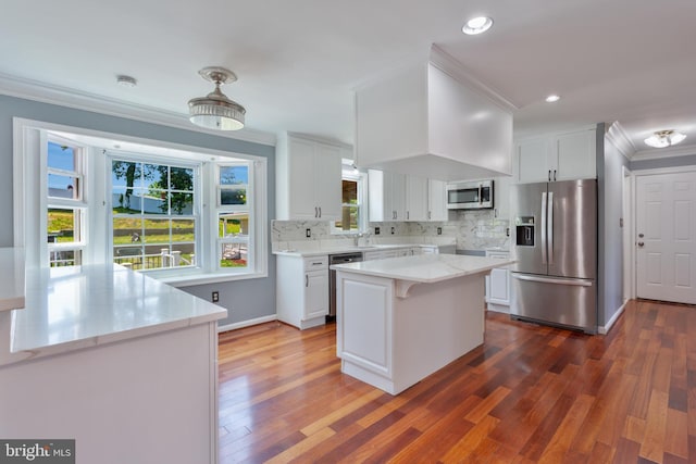 4109 Leisure Dr, Temple Hills, MD 20748 - kitchen featuring appliances with stainless steel finishes, ornamental molding, white cabinetry, dark wood-type flooring, and backsplash