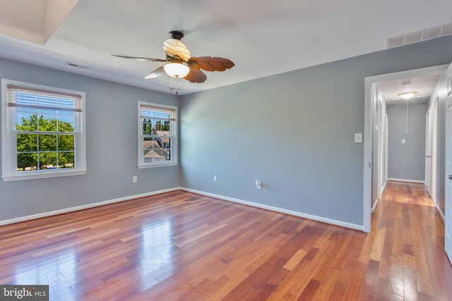 4109 Leisure Dr, Temple Hills, MD 20748 - spare room with attic access, wood finished floors, a ceiling fan, and baseboards