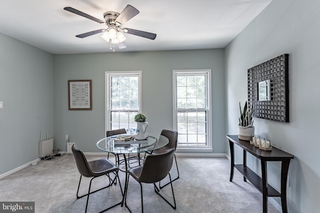 10447 Carriagepark Ct, Fairfax, VA 22032 - carpeted dining area with baseboards and ceiling fan