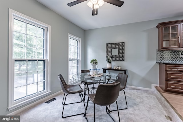 10447 Carriagepark Ct, Fairfax, VA 22032 - dining room featuring ceiling fan and light carpet