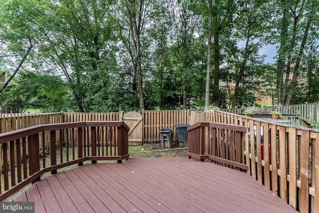 10447 Carriagepark Ct, Fairfax, VA 22032 - deck with a fenced backyard and view of wooded area
