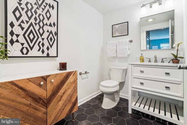 3101 N Hampton Dr Unit 314, Alexandria, VA 22302 - half bath featuring vanity, toilet, tile patterned flooring, and baseboards