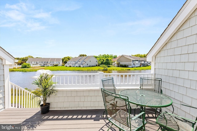 9729 Village Ln Unit 9715C, Ocean City, MD 21842 - wooden deck with a water view, a residential view, and outdoor dining space