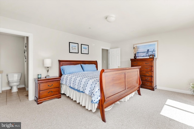 9729 Village Ln Unit 9715C, Ocean City, MD 21842 - bedroom with light colored carpet, baseboards, and ensuite bath