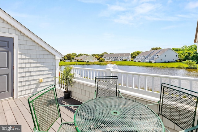 9729 Village Ln Unit 9715C, Ocean City, MD 21842 - balcony with outdoor dining area, a deck with water view, and a residential view