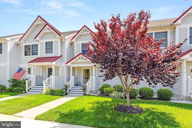 9729 Village Ln Unit 9715C, Ocean City, MD 21842 - multi unit property with a standing seam roof, a front yard, metal roof, and a porch