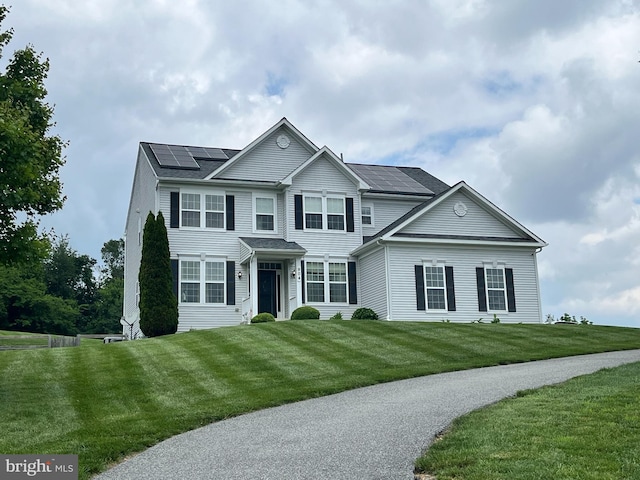 904 Open Field Ct, Westminster, MD 21157 - view of front of house with roof mounted solar panels and a front lawn