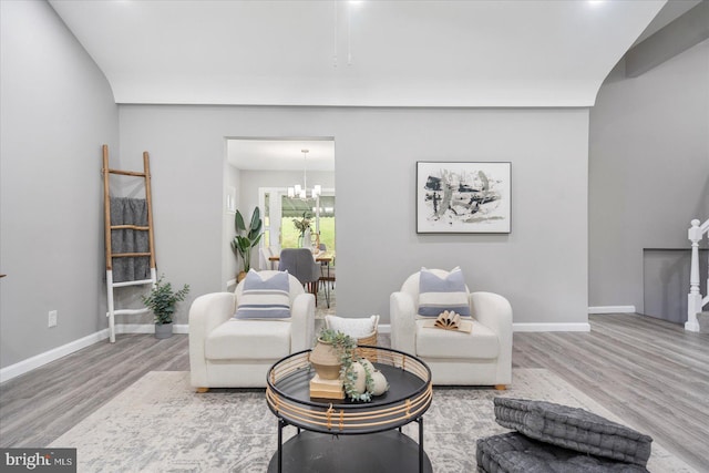 3910 The Alameda, Baltimore, MD 21218 - living area featuring wood finished floors, a chandelier, and baseboards