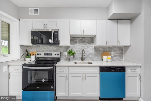 3910 The Alameda, Baltimore, MD 21218 - kitchen featuring appliances with stainless steel finishes, a sink, white cabinets, and light countertops