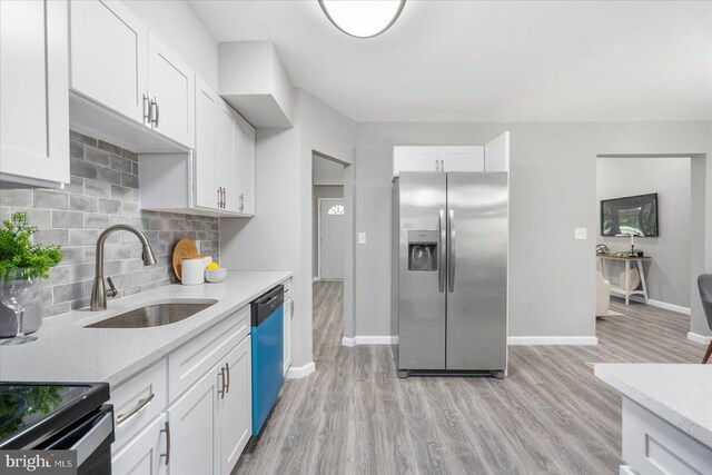 3910 The Alameda, Baltimore, MD 21218 - kitchen featuring stainless steel fridge, dishwashing machine, a sink, light wood-style flooring, and white cabinets