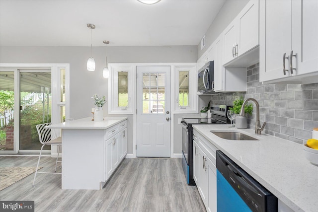3910 The Alameda, Baltimore, MD 21218 - kitchen with appliances with stainless steel finishes, a sink, plenty of natural light, and white cabinetry
