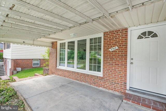 3910 The Alameda, Baltimore, MD 21218 - property entrance with brick siding and a patio area