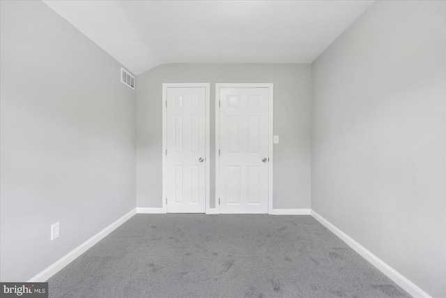 3910 The Alameda, Baltimore, MD 21218 - unfurnished bedroom with carpet floors, lofted ceiling, and baseboards