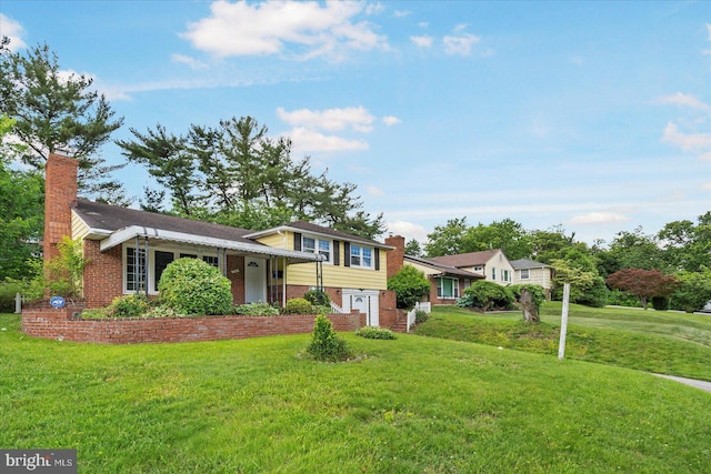 3910 The Alameda, Baltimore, MD 21218 - split level home featuring brick siding, a chimney, and a front lawn