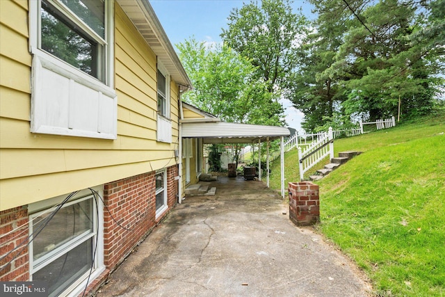 3910 The Alameda, Baltimore, MD 21218 - view of patio featuring a carport and driveway