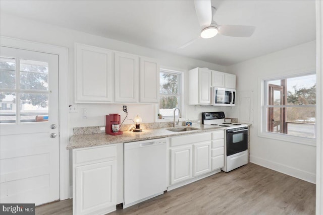 6156 Drum Point Rd, Deale, MD 20751 - kitchen with white appliances, a sink, white cabinetry, a ceiling fan, and light wood-style floors