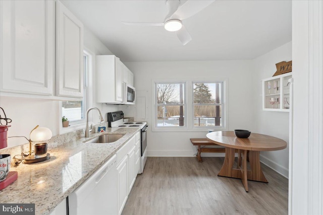 6156 Drum Point Rd, Deale, MD 20751 - kitchen featuring white appliances, baseboards, a sink, and white cabinets