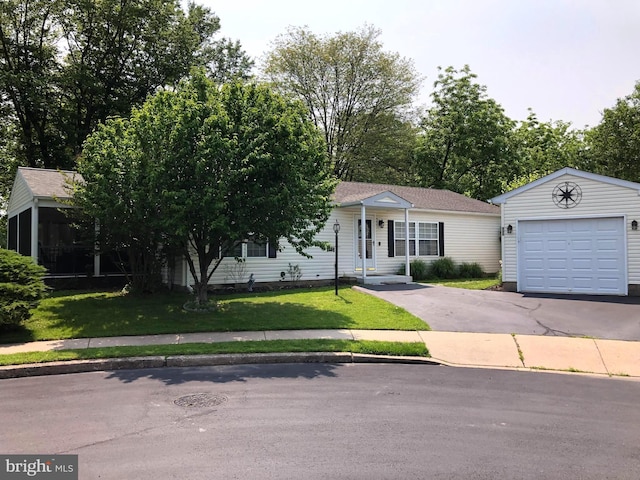 312 Farm Ln, North Wales, PA 19454 - view of front facade with a garage, driveway, a front lawn, and a sunroom