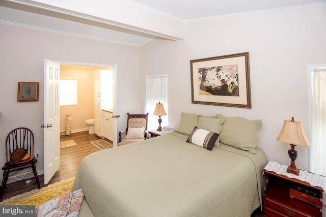 312 Farm Ln, North Wales, PA 19454 - bedroom with light wood-style flooring, crown molding, connected bathroom, and baseboards
