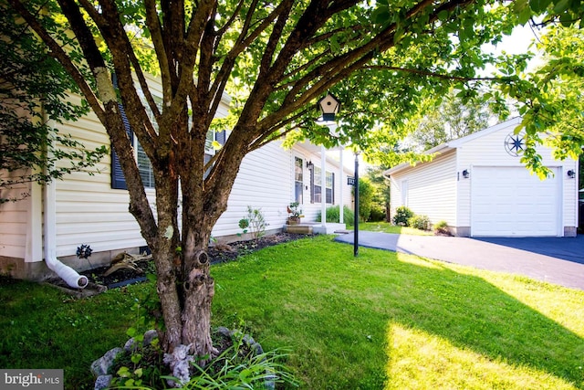 312 Farm Ln, North Wales, PA 19454 - view of green lawn with an attached garage and asphalt driveway