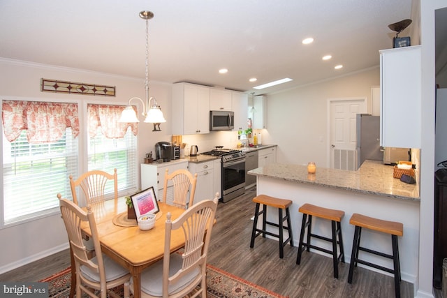 312 Farm Ln, North Wales, PA 19454 - dining area with crown molding, dark wood-style flooring, recessed lighting, a chandelier, and baseboards