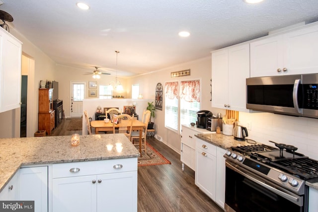 312 Farm Ln, North Wales, PA 19454 - kitchen featuring appliances with stainless steel finishes, dark wood finished floors, plenty of natural light, white cabinets, and recessed lighting