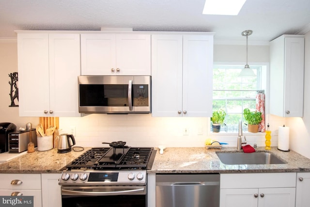 312 Farm Ln, North Wales, PA 19454 - kitchen featuring stainless steel appliances, a sink, ornamental molding, and white cabinets