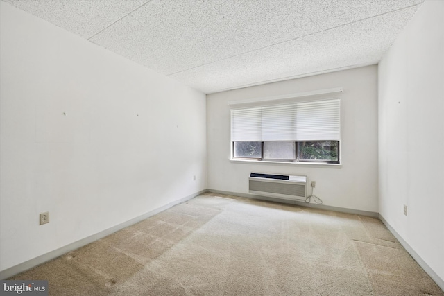 800 Avondale Rd Unit 2C, Wallingford, PA 19086 - carpeted spare room featuring a textured ceiling and a wall mounted air conditioner