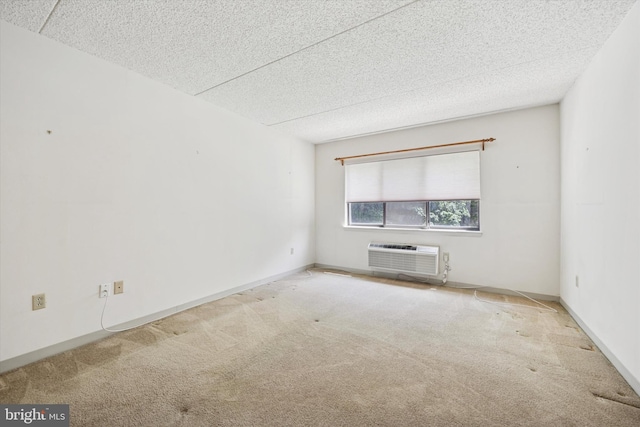 800 Avondale Rd Unit 2C, Wallingford, PA 19086 - carpeted spare room featuring a wall mounted air conditioner and a textured ceiling
