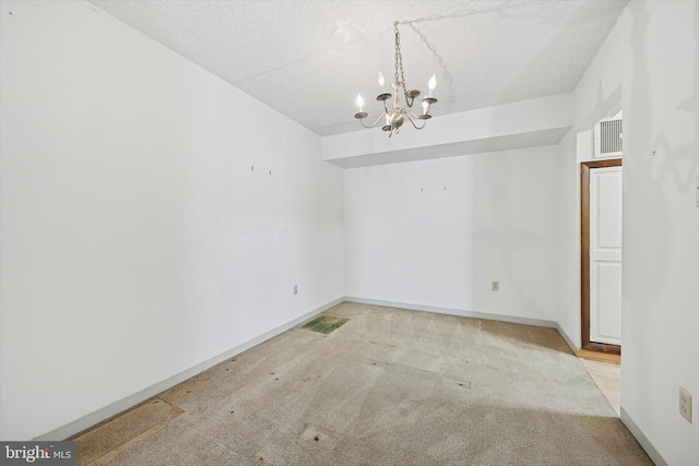 800 Avondale Rd Unit 2C, Wallingford, PA 19086 - unfurnished dining area featuring carpet flooring, a chandelier, a textured ceiling, and baseboards