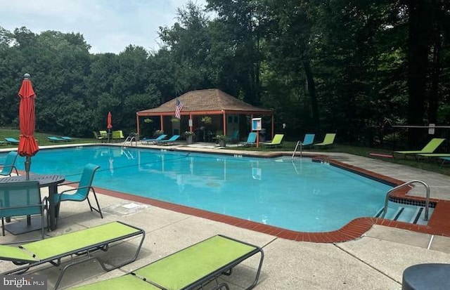 800 Avondale Rd Unit 2C, Wallingford, PA 19086 - community pool featuring a patio, a gazebo, and a view of trees
