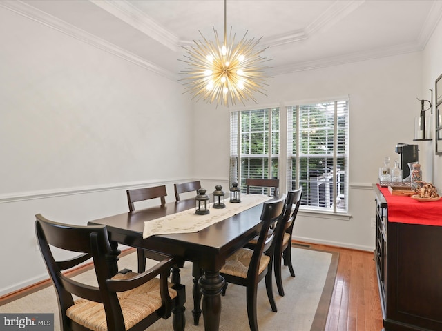 3903 Beeker Mill Pl, Chantilly, VA 20151 - dining room featuring a chandelier, light wood finished floors, a tray ceiling, and crown molding