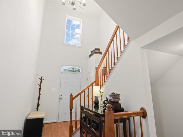 3903 Beeker Mill Pl, Chantilly, VA 20151 - foyer with wood finished floors, stairway, a chandelier, and a high ceiling